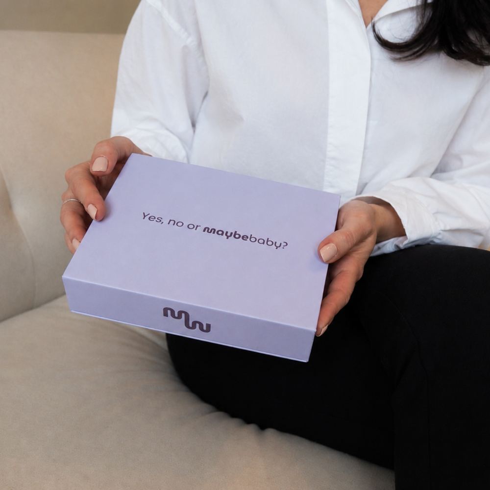 Woman holding the Maybe Baby box in her lap